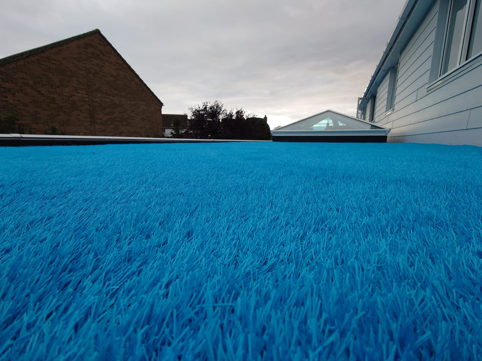 All Aspect Flooring; Case Study: Artificial Grass Installation on a Flat Roof in Mudeford